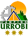 Camping Urrobi logo. The sun shines behind the Collegiate Church of Roncesvalles and the Cruz de Santiago. Above them a Canadian tent and the name of Camping Urrobi at its feet. Under the logo three golden stars.